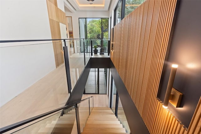 1115 Gillespie Pl, Austin, TX 78704 - staircase with wood finished floors and a tray ceiling