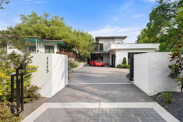 1115 Gillespie Pl, Austin, TX 78704 - view of front of home featuring stucco siding and a gate