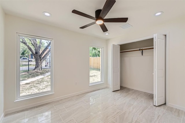 5403 Village Ln, Austin, TX 78744 - unfurnished bedroom featuring multiple windows, baseboards, recessed lighting, a closet, and ceiling fan