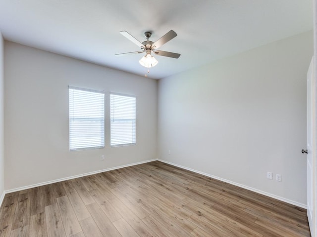 204 Magione St, Hutto, TX 78634 - unfurnished room featuring wood finished floors, a ceiling fan, and baseboards