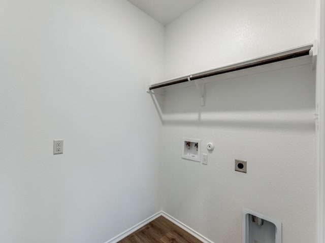 204 Magione St, Hutto, TX 78634 - laundry room featuring electric dryer hookup, hookup for a gas dryer, dark wood-style flooring, washer hookup, and baseboards