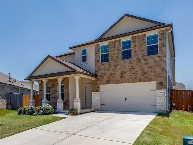204 Magione St, Hutto, TX 78634 - view of front of property with an attached garage, brick siding, a porch, stone siding, and concrete driveway