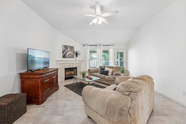6015 Lone Star Ct, Hutto, TX 78634 - living room with ceiling fan, vaulted ceiling, and a tiled fireplace