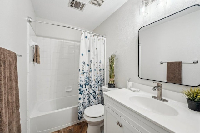 6015 Lone Star Ct, Hutto, TX 78634 - bathroom featuring vanity, toilet, shower / bathtub combination with curtain, and wood finished floors