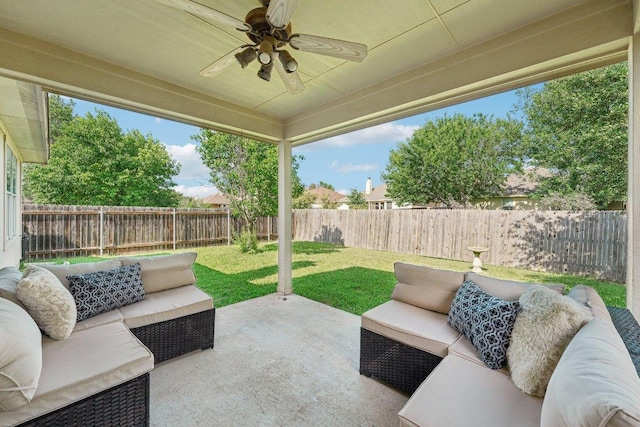 6015 Lone Star Ct, Hutto, TX 78634 - fenced backyard with an outdoor living space, a patio area, and ceiling fan