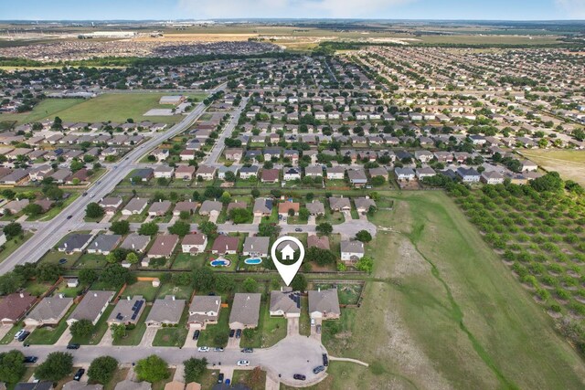 6015 Lone Star Ct, Hutto, TX 78634 - aerial overview of property's location with nearby suburban area