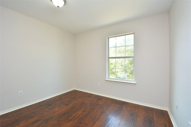 1902 Tranquilo Trl, Austin, TX 78744 - unfurnished room featuring baseboards and dark wood-type flooring