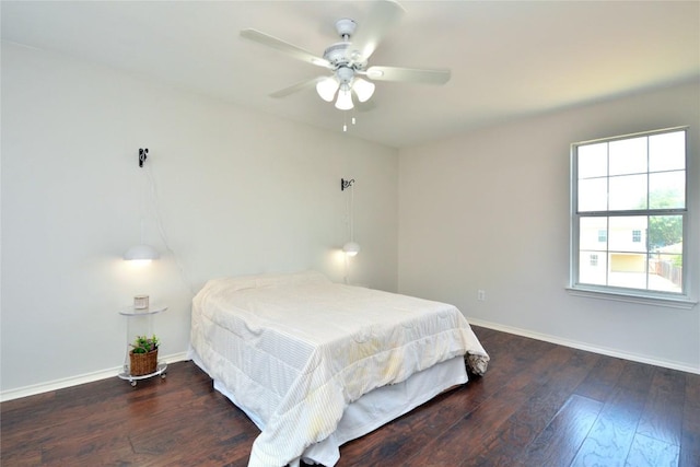 1902 Tranquilo Trl, Austin, TX 78744 - bedroom featuring baseboards, wood finished floors, and ceiling fan