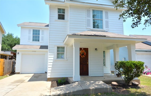 1902 Tranquilo Trl, Austin, TX 78744 - view of front facade featuring a porch, an attached garage, and driveway