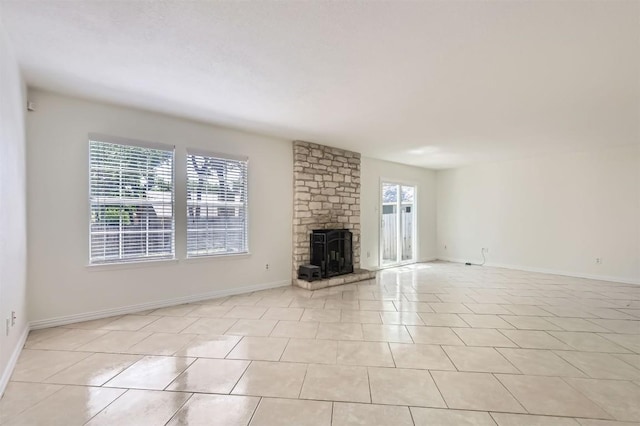 11619 Birchbark Trl, Austin, TX 78750 - unfurnished living room featuring a fireplace, light tile patterned flooring, and baseboards