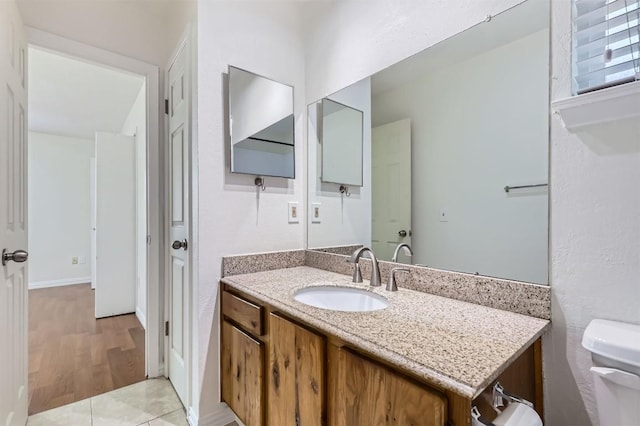11619 Birchbark Trl, Austin, TX 78750 - bathroom with vanity, toilet, and wood finished floors