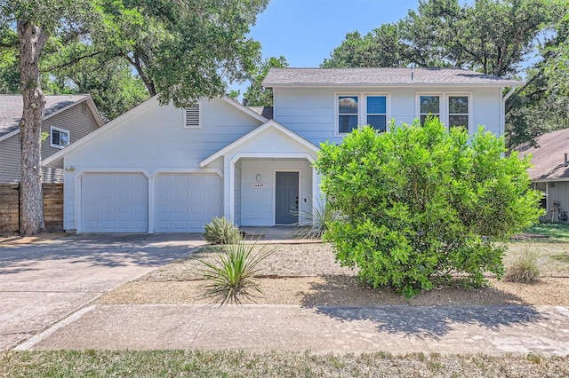 11619 Birchbark Trl, Austin, TX 78750 - view of front of home with a garage and driveway