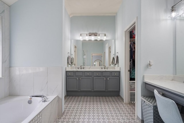 15617 Staffordshire Ln, Austin, TX 78717 - full bath with tile patterned floors, double vanity, a garden tub, and a walk in closet