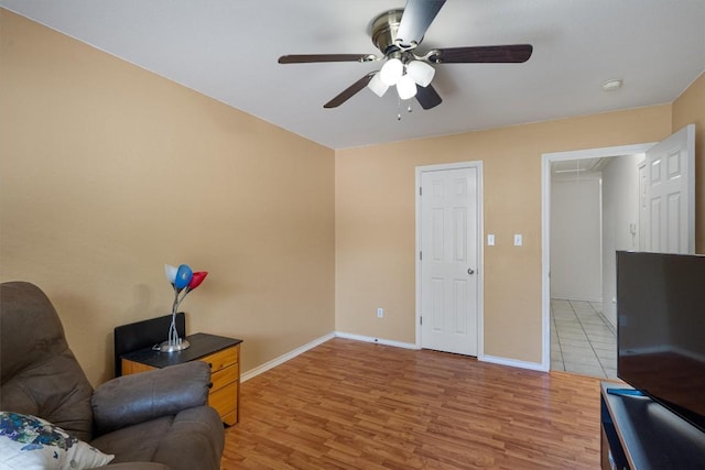 15617 Staffordshire Ln, Austin, TX 78717 - living area with attic access, ceiling fan, light wood-type flooring, and baseboards