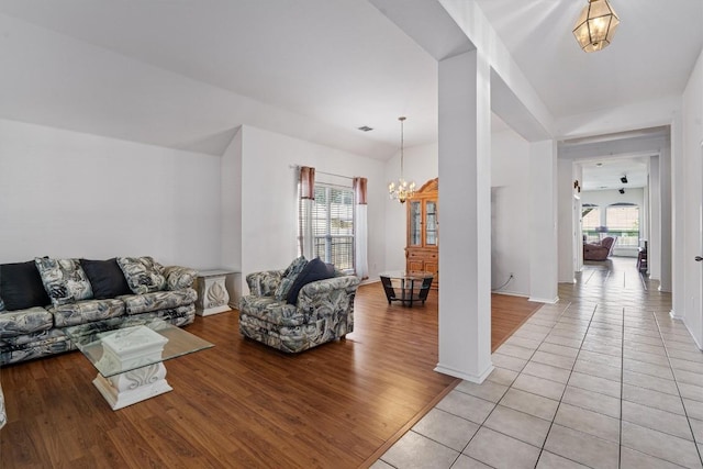 15617 Staffordshire Ln, Austin, TX 78717 - living room with plenty of natural light, a chandelier, light wood-style flooring, and baseboards
