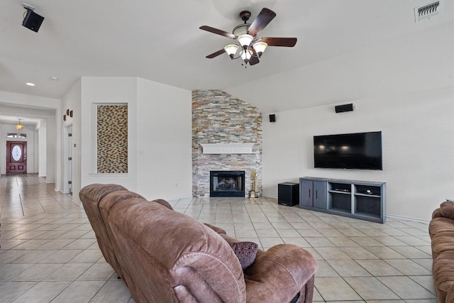 15617 Staffordshire Ln, Austin, TX 78717 - living area with light tile patterned flooring, a ceiling fan, lofted ceiling, and a stone fireplace