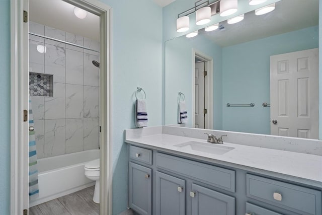 15617 Staffordshire Ln, Austin, TX 78717 - bathroom with vanity, shower / tub combo with curtain, and wood finished floors