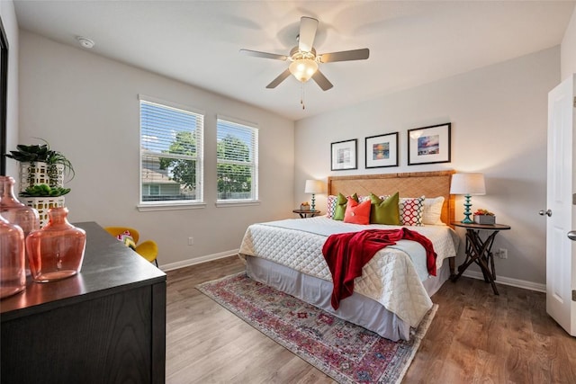 212 Canis St, Georgetown, TX 78628 - bedroom featuring baseboards, wood finished floors, and ceiling fan