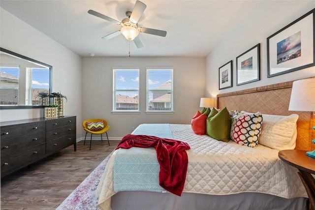 212 Canis St, Georgetown, TX 78628 - bedroom featuring wood finished floors, baseboards, and a ceiling fan