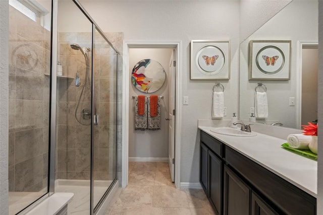 212 Canis St, Georgetown, TX 78628 - bathroom with a stall shower, vanity, and baseboards