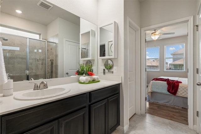 212 Canis St, Georgetown, TX 78628 - ensuite bathroom featuring vanity, a shower stall, ceiling fan, and tile patterned flooring