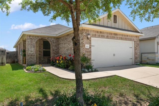 212 Canis St, Georgetown, TX 78628 - view of front facade with driveway, an attached garage, brick siding, board and batten siding, and a shingled roof