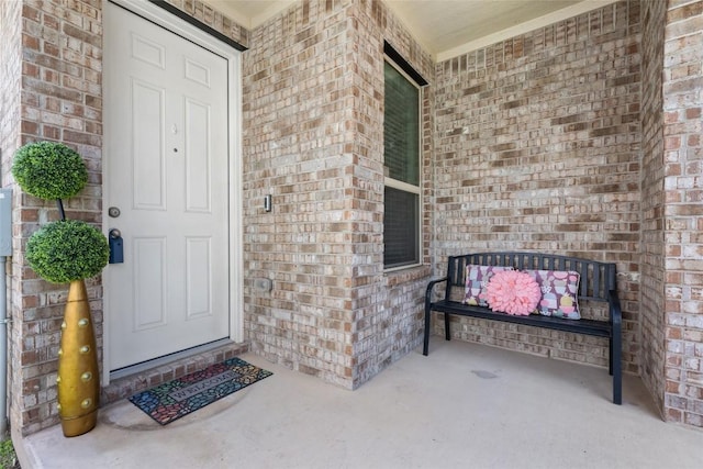 212 Canis St, Georgetown, TX 78628 - entrance to property featuring brick siding and a porch
