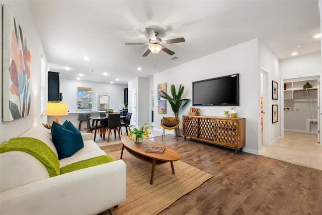 212 Canis St, Georgetown, TX 78628 - living area featuring light wood-style flooring, a ceiling fan, recessed lighting, and baseboards
