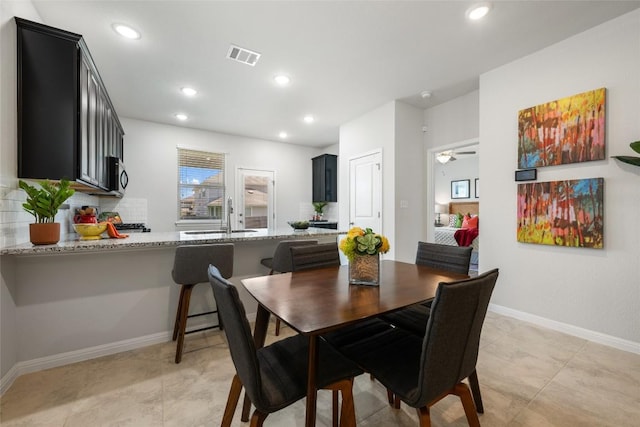 212 Canis St, Georgetown, TX 78628 - dining room featuring recessed lighting, baseboards, and light tile patterned flooring