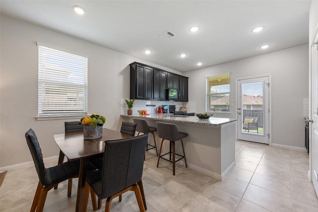 212 Canis St, Georgetown, TX 78628 - dining room featuring recessed lighting, baseboards, and light tile patterned floors