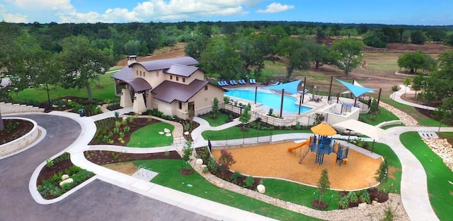 212 Canis St, Georgetown, TX 78628 - bird's eye view of a pool and a heavily wooded area