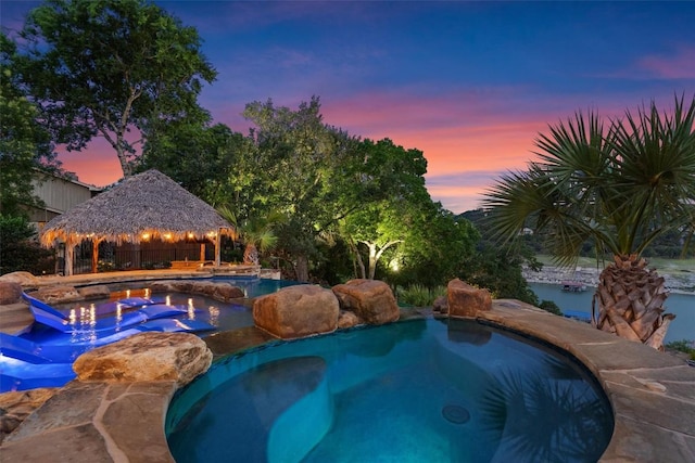 17505 E Darleen Dr, Leander, TX 78641 - pool at dusk featuring a gazebo and an in-ground hot tub