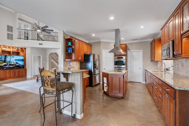 17505 E Darleen Dr, Leander, TX 78641 - kitchen with open shelves, island exhaust hood, stainless steel appliances, a sink, and light stone counters