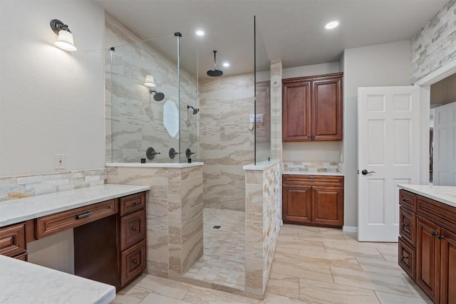 17505 E Darleen Dr, Leander, TX 78641 - full bathroom featuring walk in shower, vanity, marble look tile flooring, and recessed lighting