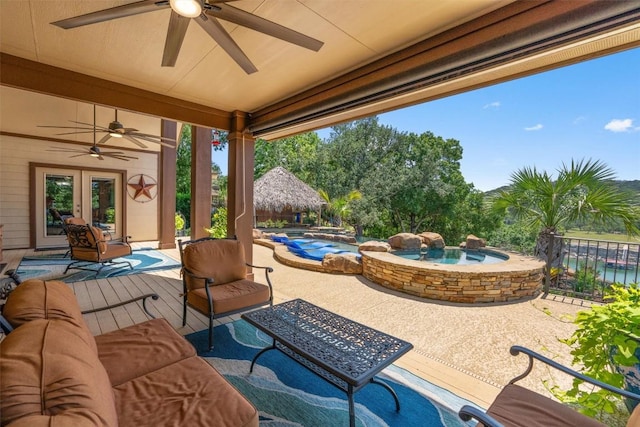 17505 E Darleen Dr, Leander, TX 78641 - view of patio / terrace with ceiling fan, an in-ground hot tub, french doors, and an outdoor pool