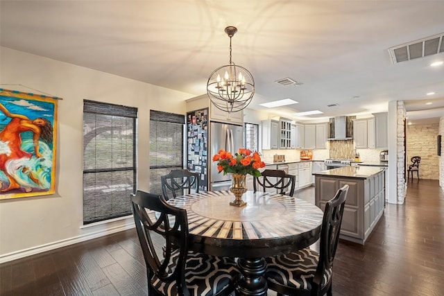 2924 Gabriel View Dr, Georgetown, TX 78628 - dining area with a chandelier, dark wood-style floors, baseboards, and recessed lighting