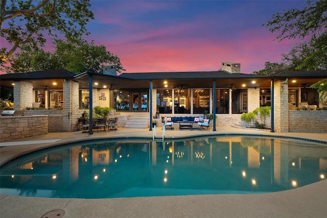 2924 Gabriel View Dr, Georgetown, TX 78628 - pool at dusk with an outdoor hangout area, a ceiling fan, area for grilling, a patio, and an outdoor pool