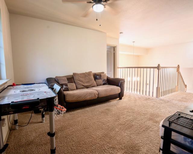 1406 Apache Cv, Pflugerville, TX 78660 - carpeted living room featuring a ceiling fan