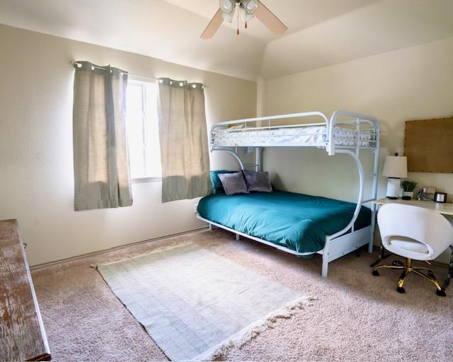 1406 Apache Cv, Pflugerville, TX 78660 - bedroom with carpet flooring and a ceiling fan