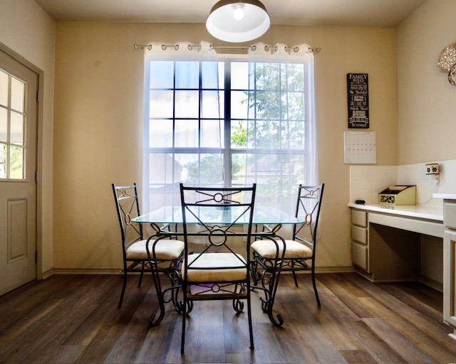 1406 Apache Cv, Pflugerville, TX 78660 - dining room with healthy amount of natural light and wood finished floors