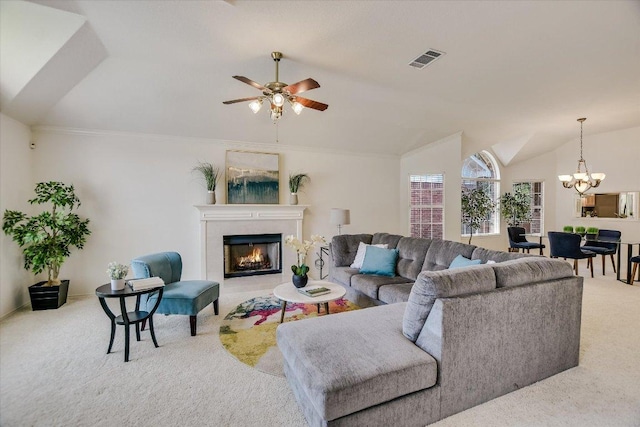 10902 Sierra Oaks, Austin, TX 78759 - living area featuring carpet, a lit fireplace, a chandelier, a ceiling fan, and vaulted ceiling