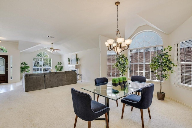 10902 Sierra Oaks, Austin, TX 78759 - dining room featuring vaulted ceiling, a chandelier, light carpet, ceiling fan, and baseboards