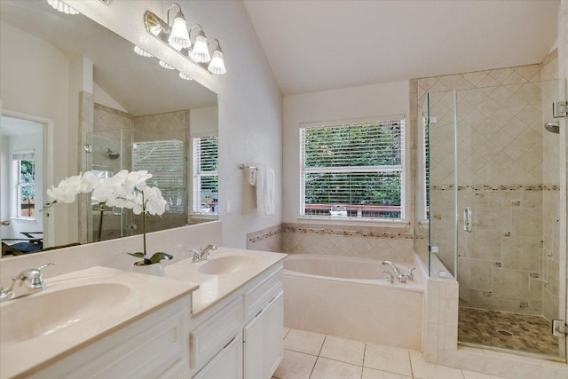 10902 Sierra Oaks, Austin, TX 78759 - full bath featuring lofted ceiling, a bath, a stall shower, double vanity, and tile patterned floors
