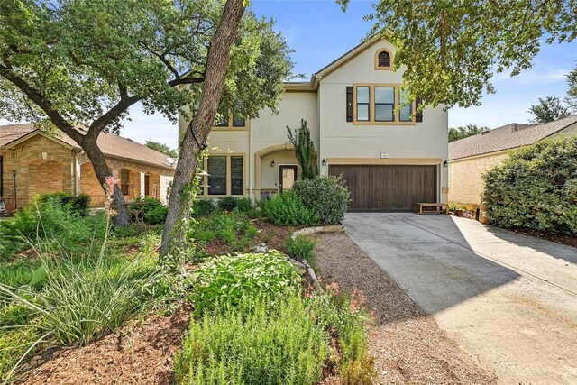 504 Tyree Rd, Cedar Park, TX 78613 - view of front of house featuring an attached garage, concrete driveway, and stucco siding
