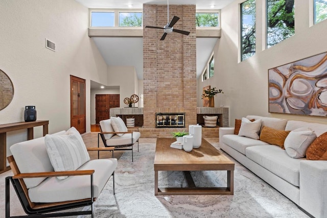 8126 Greenslope Dr, Austin, TX 78759 - living area featuring a high ceiling, a ceiling fan, and a brick fireplace