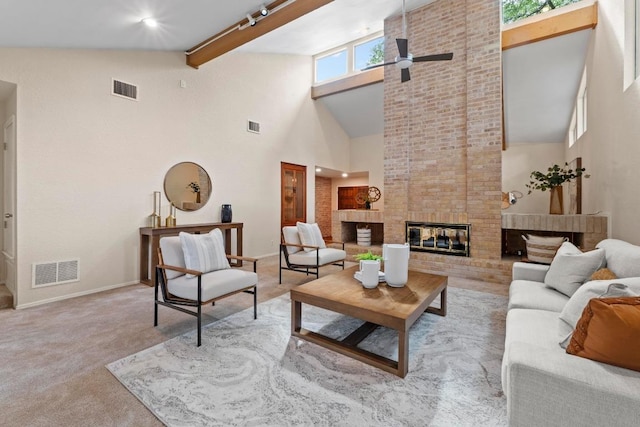 8126 Greenslope Dr, Austin, TX 78759 - carpeted living area with high vaulted ceiling, a ceiling fan, baseboards, a brick fireplace, and beamed ceiling