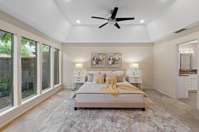 8126 Greenslope Dr, Austin, TX 78759 - bedroom featuring lofted ceiling, light colored carpet, baseboards, ensuite bathroom, and recessed lighting