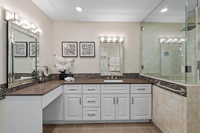 8126 Greenslope Dr, Austin, TX 78759 - full bath with tiled shower, vanity, tile patterned flooring, and recessed lighting