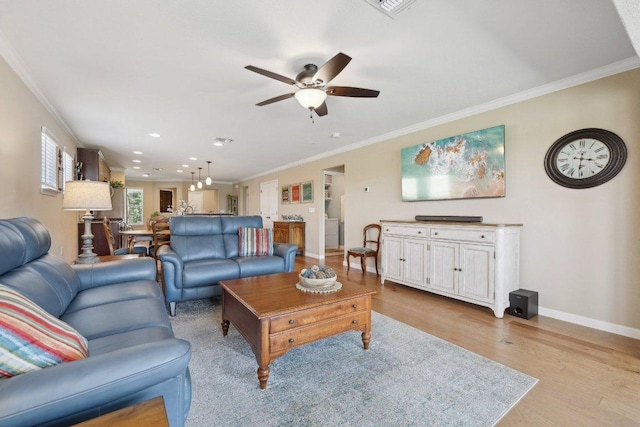 709 Kitty Hawk Rd, Georgetown, TX 78633 - living room featuring a ceiling fan, light wood-type flooring, ornamental molding, baseboards, and recessed lighting