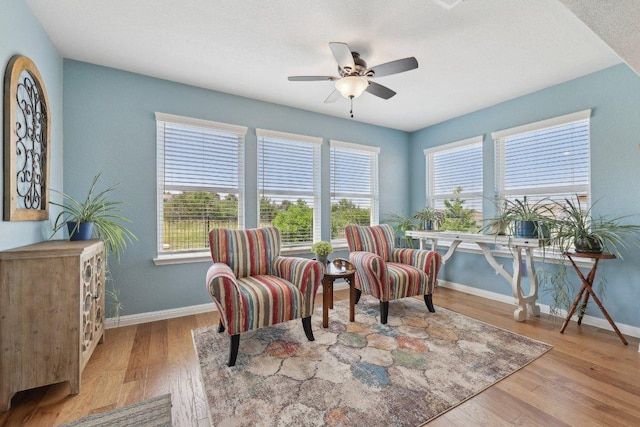 709 Kitty Hawk Rd, Georgetown, TX 78633 - living area featuring baseboards, wood finished floors, and ceiling fan